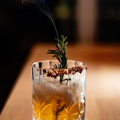 Smokey,Mezcal,Cocktail,With,Blurry,Background