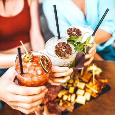 Happy,Friends,Clink,Cocktail,Glasses,At,Bar,Restaurant,-,Young