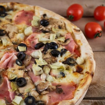 Pizza,Quattro,Stagioni,On,Rustic,Background